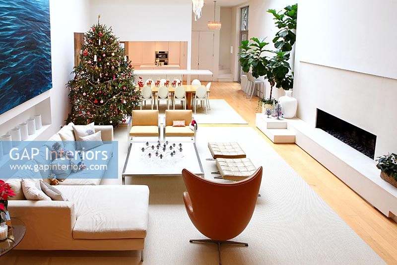 Christmas tree in open plan living room 
