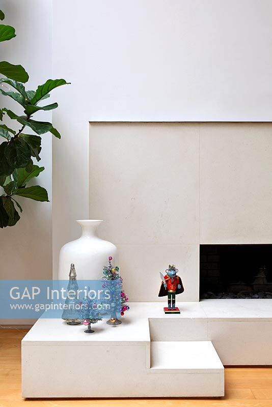 Traditional Christmas decorations on minimal fireplace