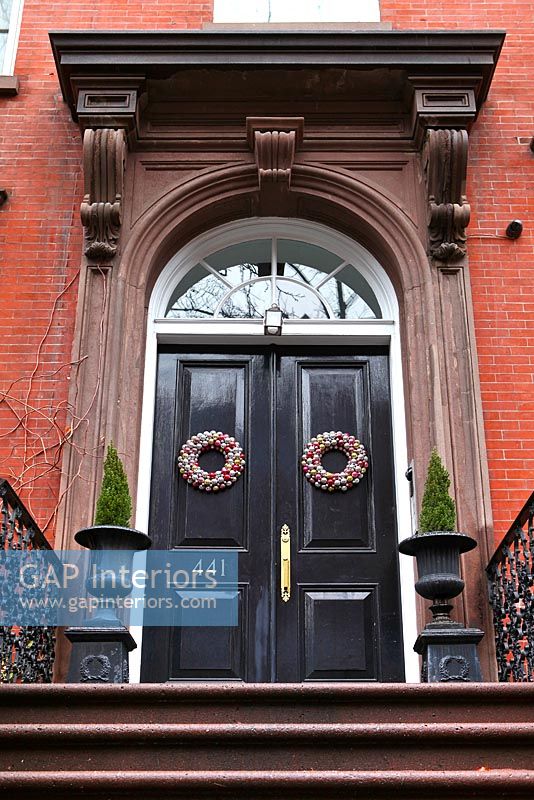 Classic front door with christmas wreaths