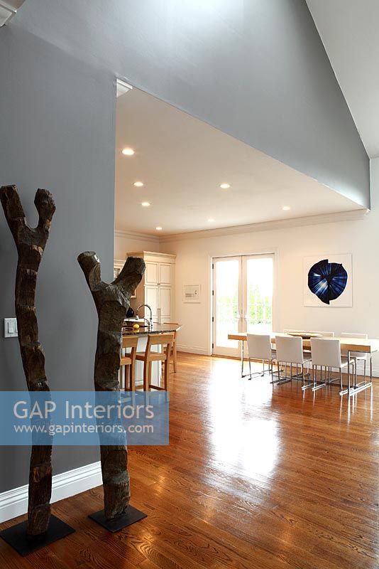 Wooden sculptures in contemporary open plan space