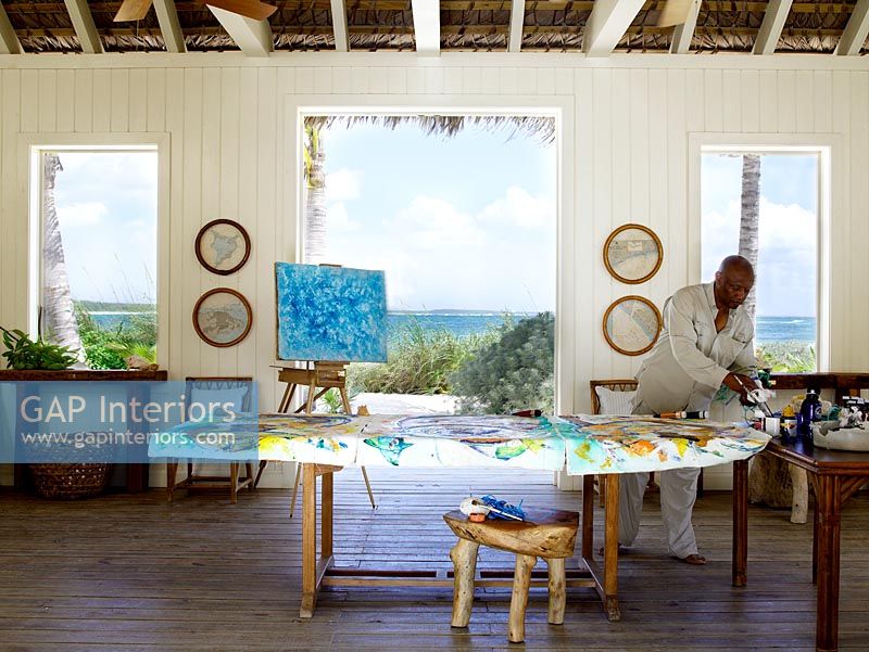 Antonius Roberts painting in his studio