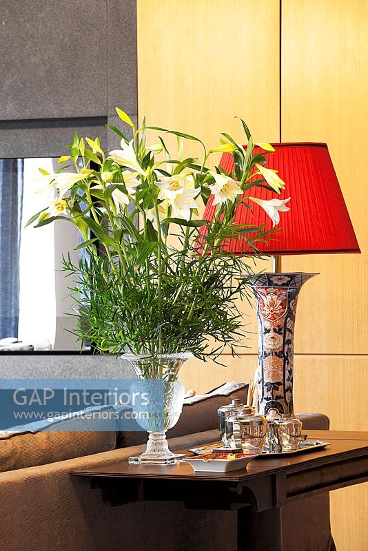Vase of Lilies and ornate lamp