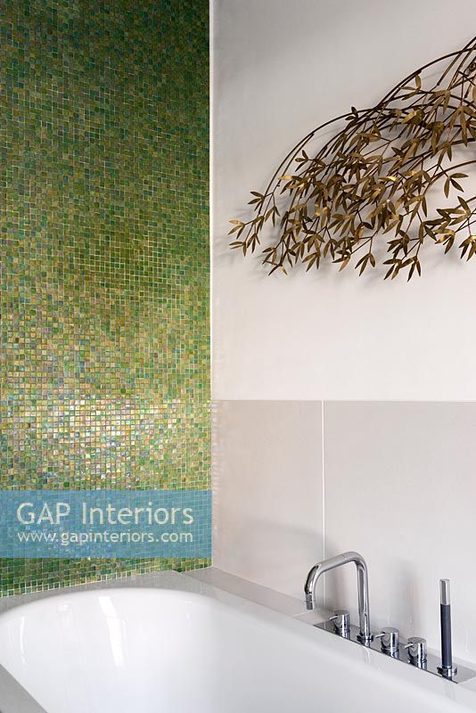 Modern bath with wall sculpture by Curtis Jere