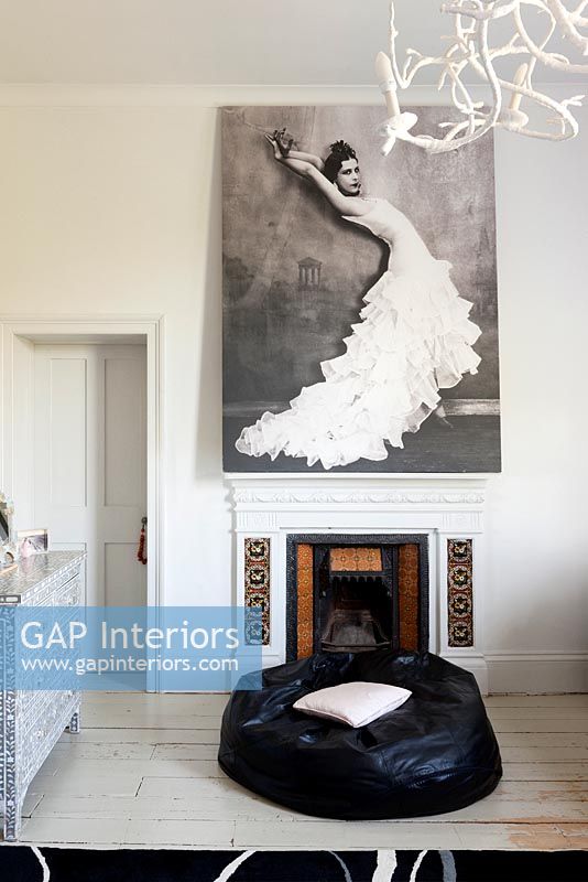 Giant photo above period fireplace 