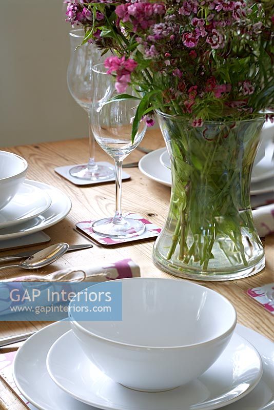 Modern tableware and vase of Sweet William flowers