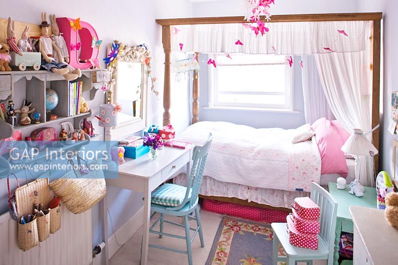 Girl's bedroom with four poster bed