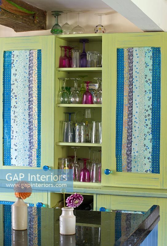 Hand painted kitchen cupboard decorated with Indian papers