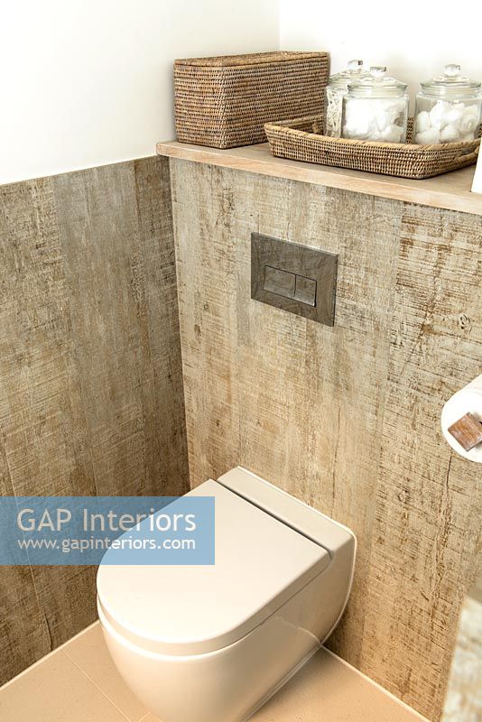 Modern toilet and wood effect tiles