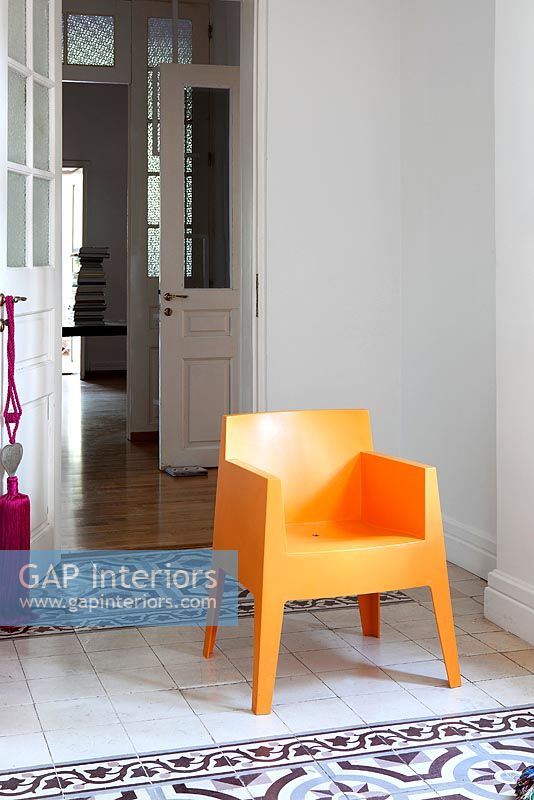 Modern orange plastic chair 

