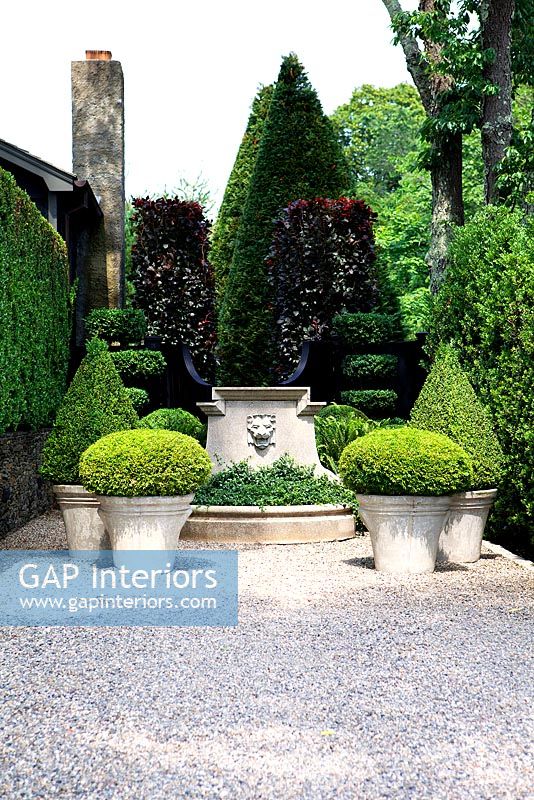 Formal garden with topiary and water feature