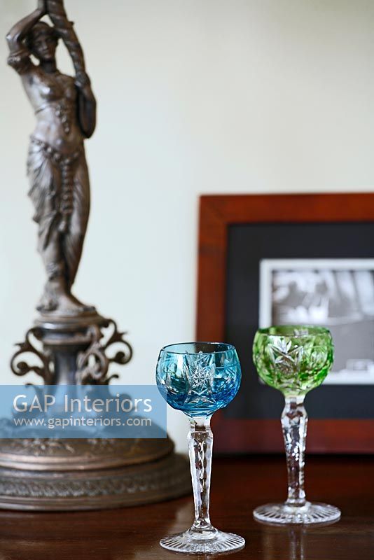 Crystal glasses and classic statue