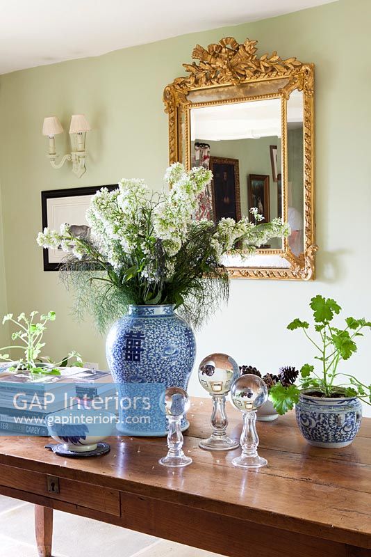 Flowers and houseplants in oriental vases