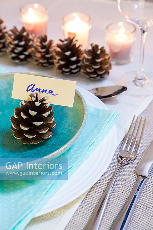 Step by Step guide for painting pine cones for a simple table decoration - finished cones being used as a place setting