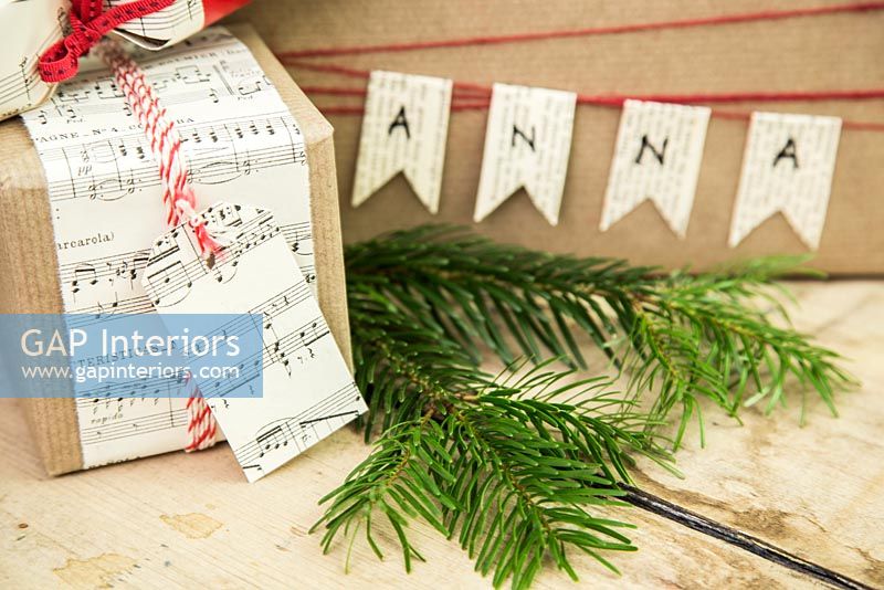 Christmas present wrapped in music sheet paper