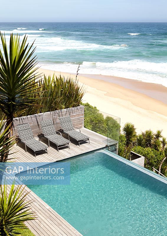 Contemporary pool overlooking beach