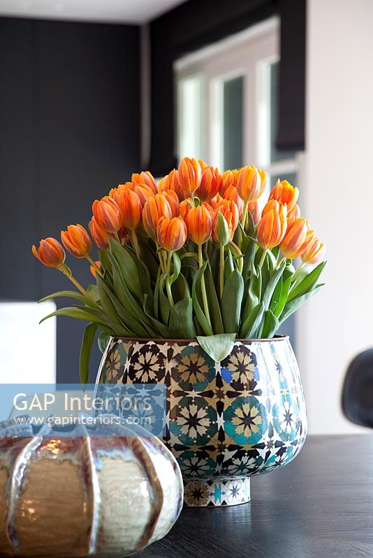 Tulips in patterned vase