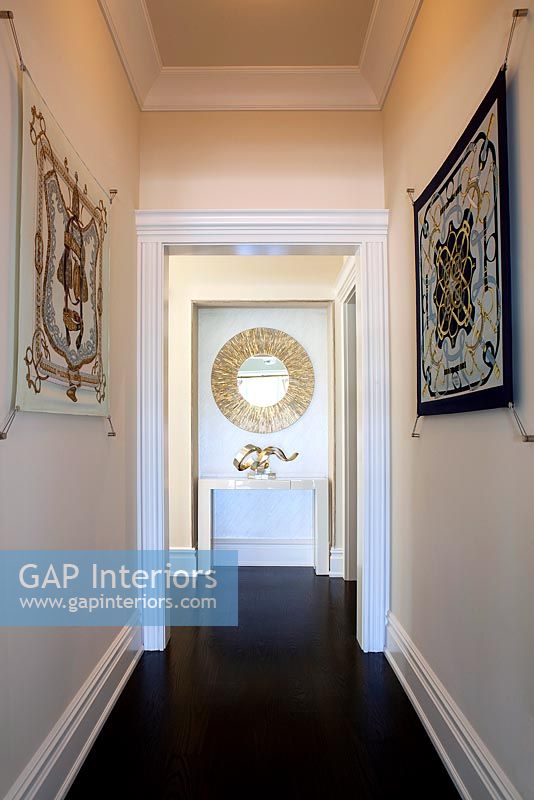 White corridor with wall hangings