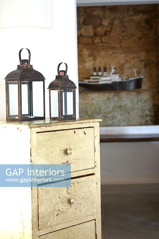 Lanterns on vintage chest of drawers