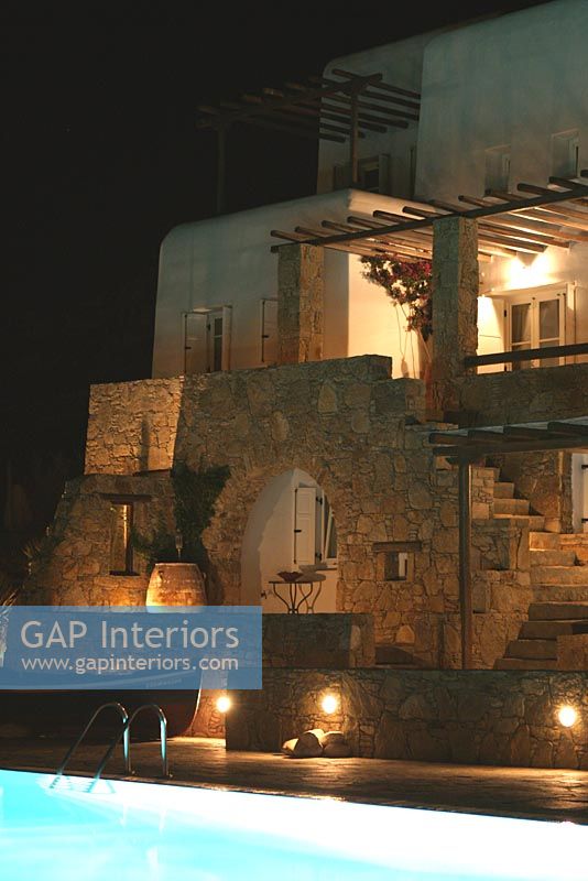 Greek villa lit up at night