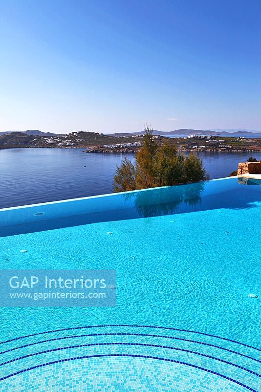 Luxury swimming pool overlooking sea