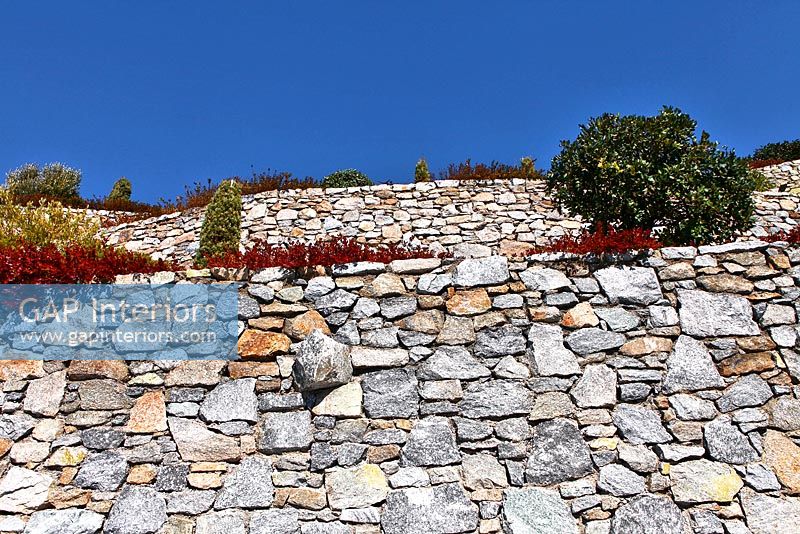 Traditional stone walls in terraced garden
