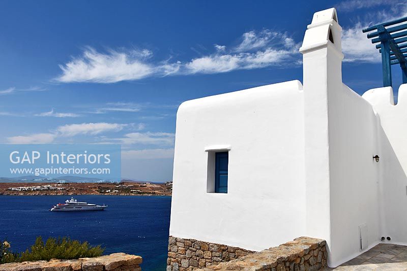 Traditional greek house overlooking sea