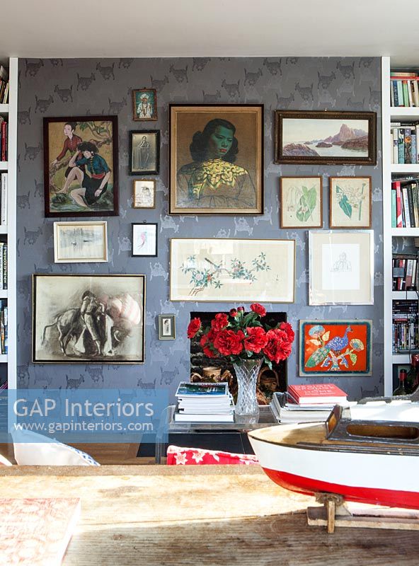 Eclectic art display on living room wall