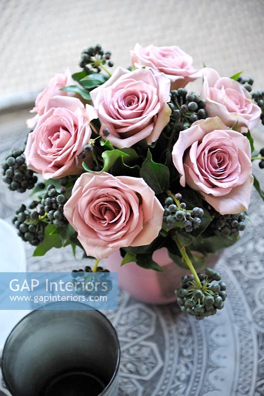 Arrangement of pink Roses and Ivy berries