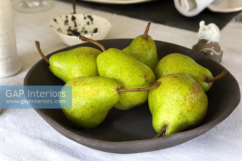 Pears in black bowl