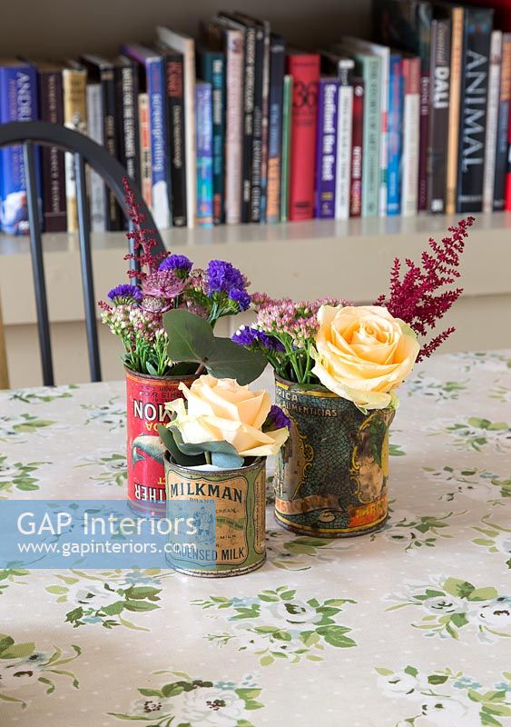 Flowers in recycled tins
