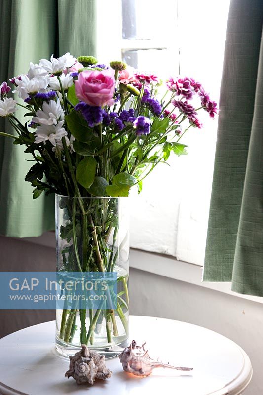 Roses and Chrysanthemums in glass vase