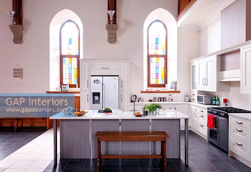 Modern open plan kitchen in converted church