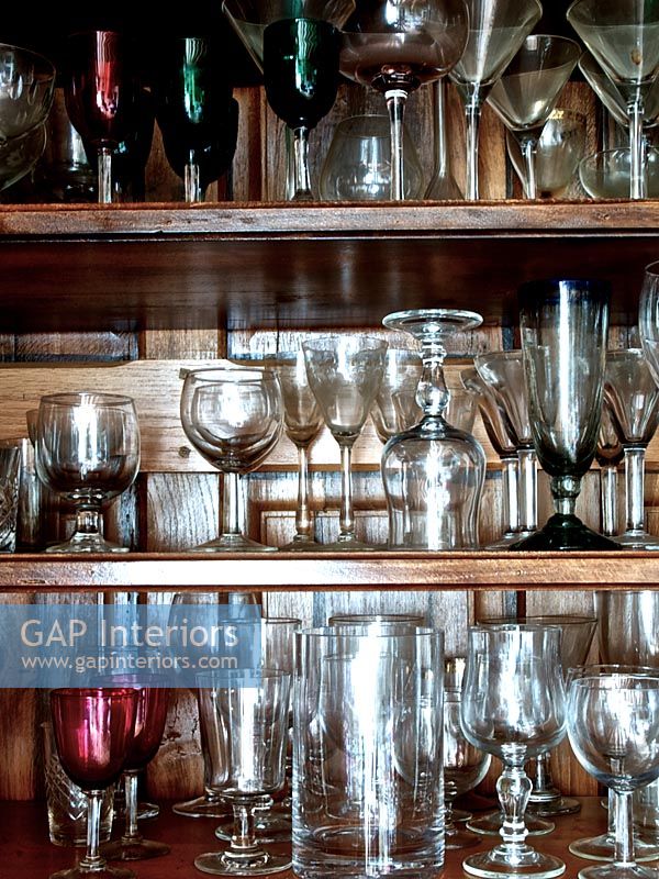 Glassware on wooden shelves