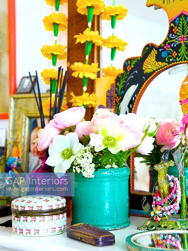 Flowers in turquoise vase