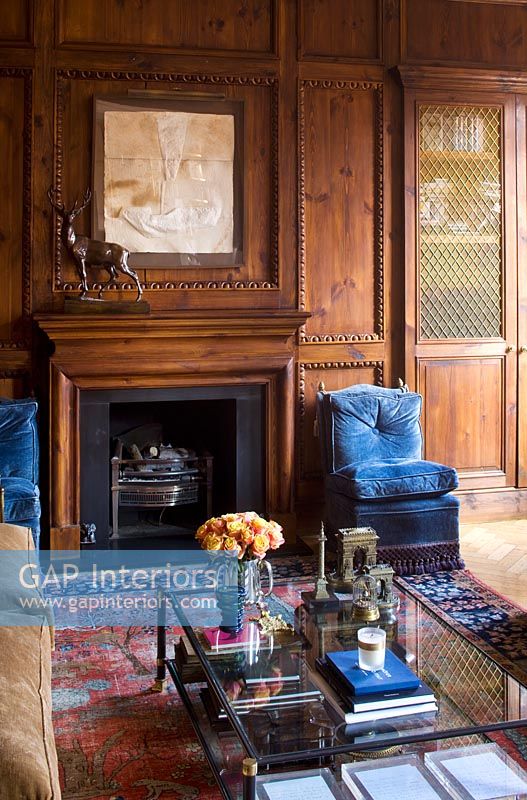 Ornate wooden panelling around fireplace