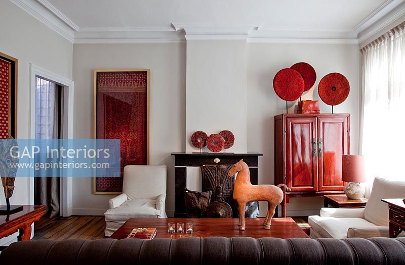 Colourful living room with eclectic art display