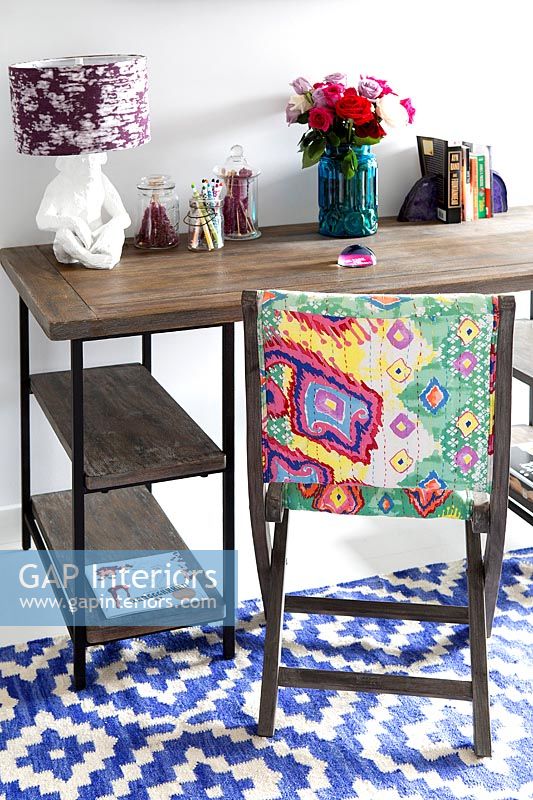 Wooden desk and patterned chair