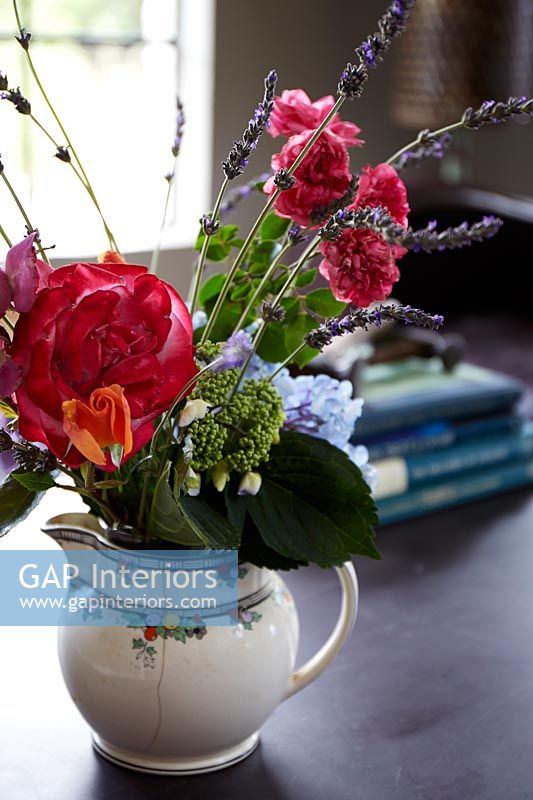 Roses, Lavenders and Sweet pea flowers in vintage jug