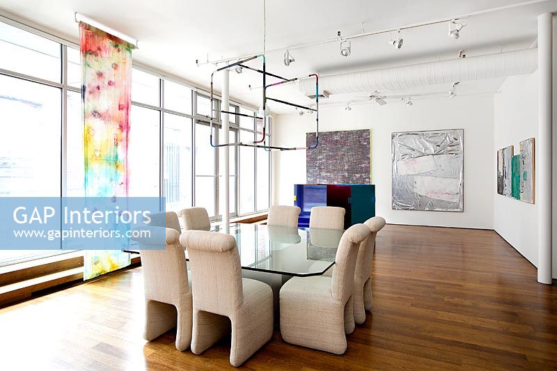 Contemporary dining room with art display