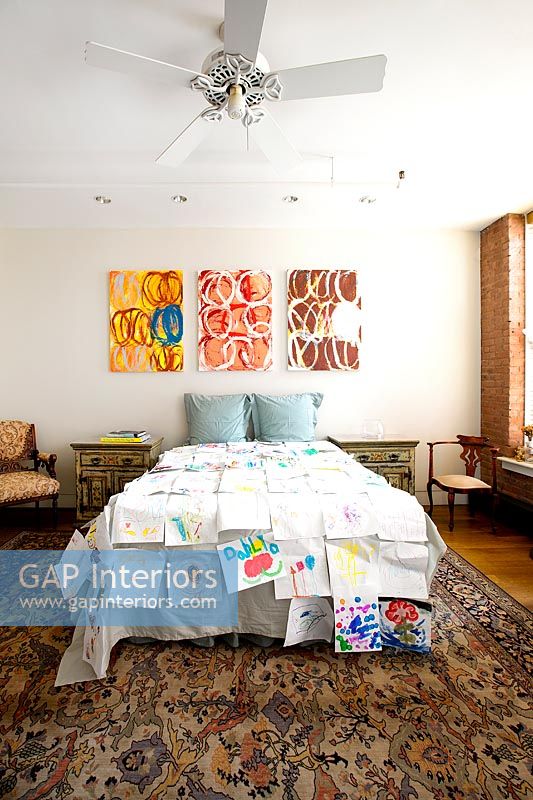 Bedroom with colourful art display