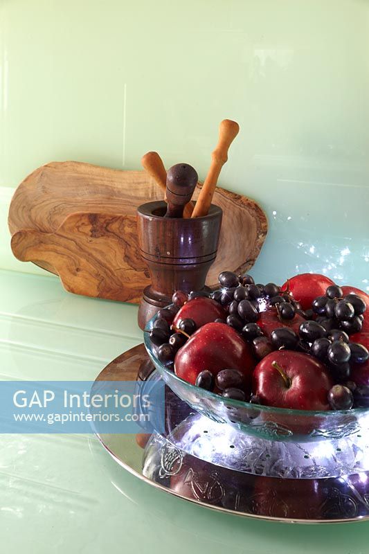 Fruit bowl on glass kitchen surface