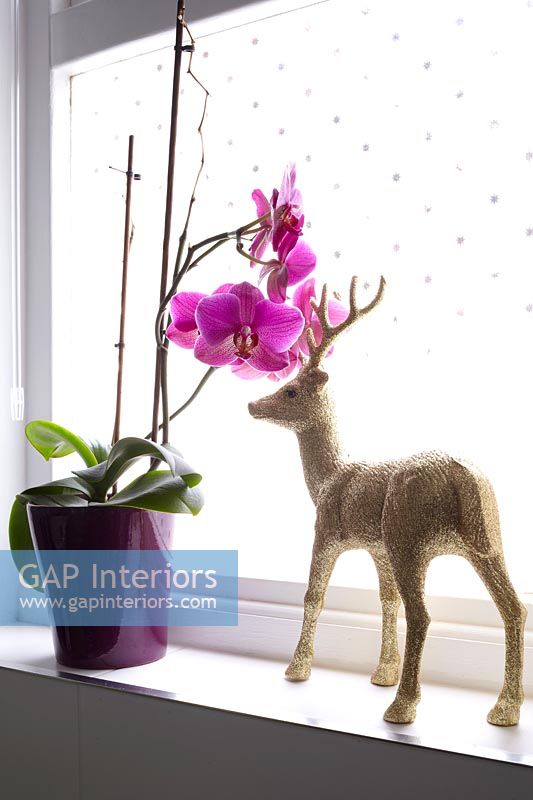 Reindeer ornament on windowsill