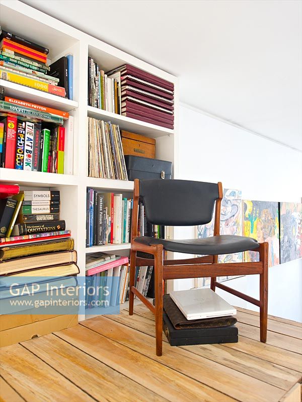 Chair by bookshelves