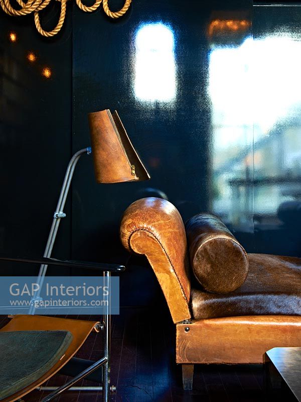 Leather chaise longue and lamp