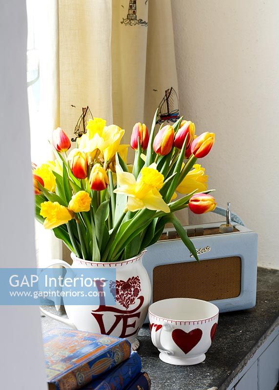 Daffodils and Tulips in patterned vase