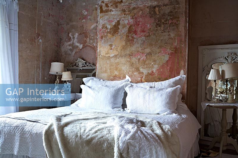 Vintage bedroom with distressed plaster walls