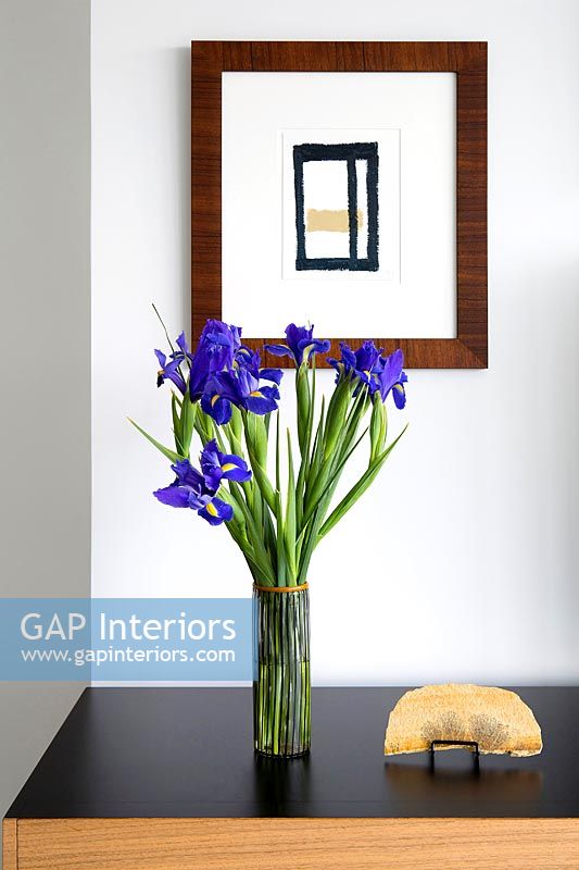 Irises in glass vase