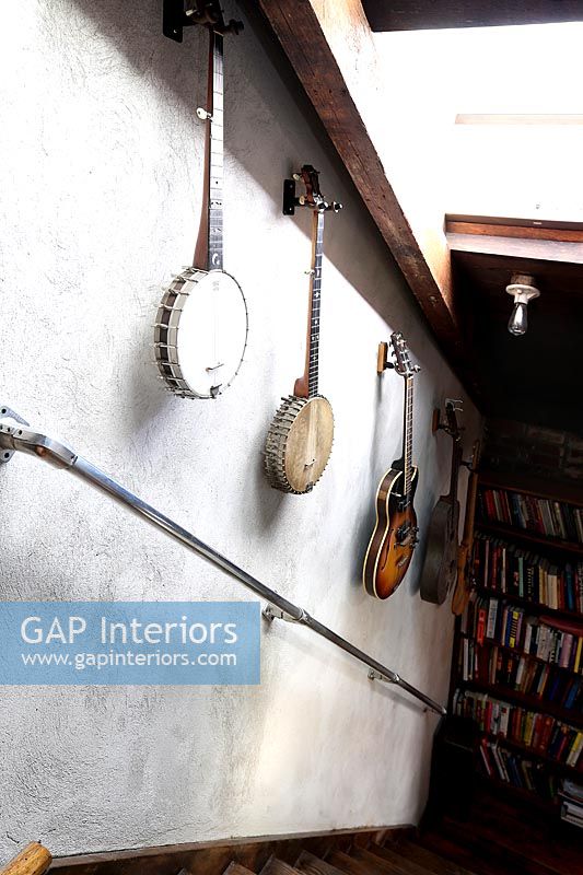 Musical instruments displayed on stairwell