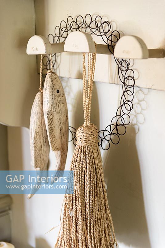 Accessories hanging from wooden hooks