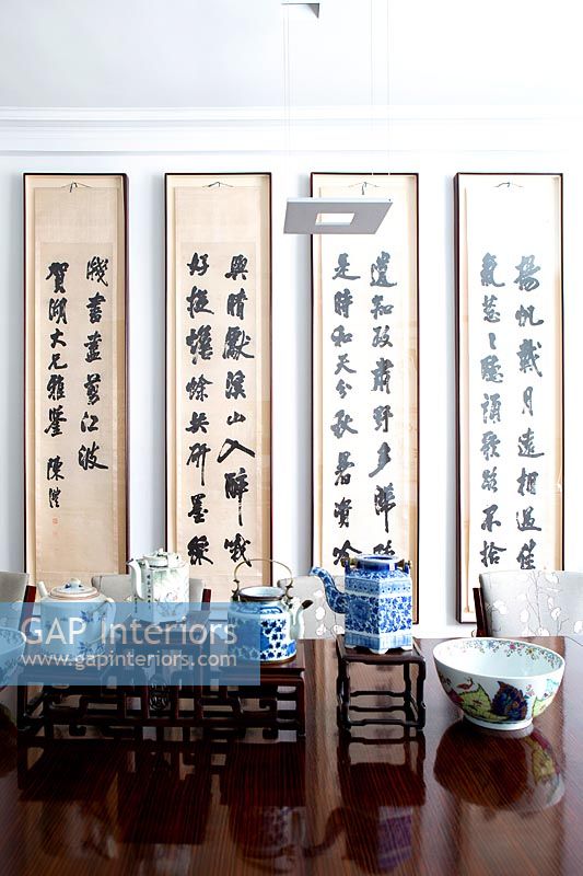 Oriental art and accessories in dining room